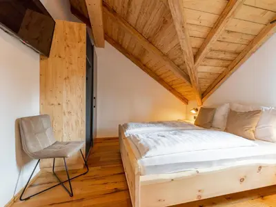 Ein Bett oder Betten in einem Zimmer der Unterkunft AlmApARTment Mauterndorf Pichl 8-3
