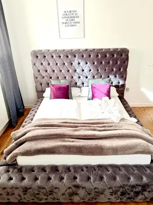 Ein Bett oder Betten in einem Zimmer der Unterkunft Appartements-Dalila