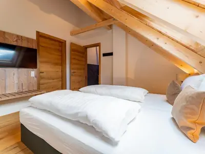 Ein Bett oder Betten in einem Zimmer der Unterkunft Mountain Chalet Alpinchique