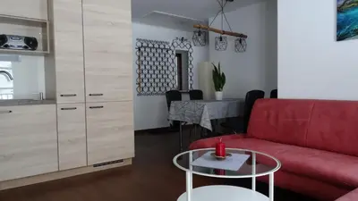 Ein Sitzbereich in der Unterkunft Apartments-Weberlandl