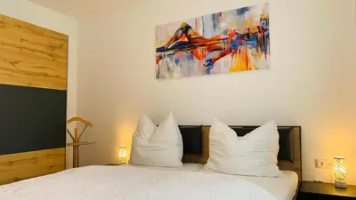 Ein Bett oder Betten in einem Zimmer der Unterkunft Ferienwohnung Mühlwang