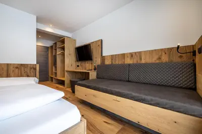 Ein Bett oder Betten in einem Zimmer der Unterkunft Gästehaus Mirzl