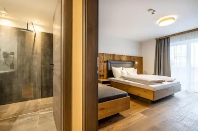 Ein Bett oder Betten in einem Zimmer der Unterkunft Gästehaus Mirzl