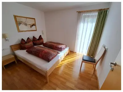 Ein Bett oder Betten in einem Zimmer der Unterkunft Laerchenlodge
