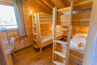 Ein Bett oder Betten in einem Zimmer der Unterkunft Chalet Huber by Alpenidyll Apartments