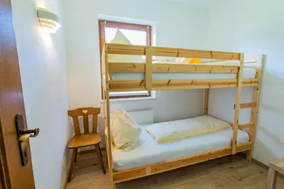 Ein Bett oder Betten in einem Zimmer der Unterkunft Huberhof 10 by Alpenidyll Apartments
