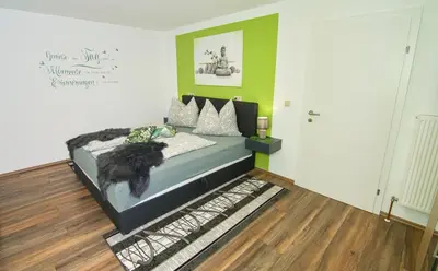 Ein Bett oder Betten in einem Zimmer der Unterkunft Ferienwohnung Berg(Aus)zeit Ennstal