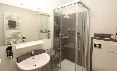 Ein Badezimmer in der Unterkunft Hotel Pension Residence