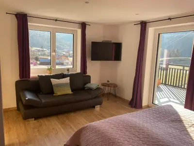 Ein Sitzbereich in der Unterkunft Apartments z‘Haus