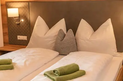 Ein Bett oder Betten in einem Zimmer der Unterkunft Appartements Die Ramsauerin