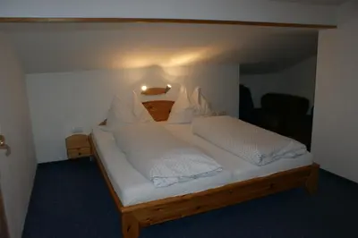 Ein Bett oder Betten in einem Zimmer der Unterkunft Gästehaus Kübler