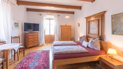 Ein Bett oder Betten in einem Zimmer der Unterkunft Schweizerhof am See