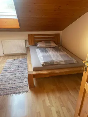 Ein Bett oder Betten in einem Zimmer der Unterkunft Ferienwohnung ,Hoizmann`