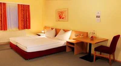 Ein Bett oder Betten in einem Zimmer der Unterkunft Hotel Denk Bed & Breakfast