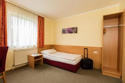Ein Bett oder Betten in einem Zimmer der Unterkunft Hotel Denk Bed & Breakfast