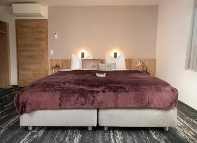 Ein Bett oder Betten in einem Zimmer der Unterkunft good-goisern hotel