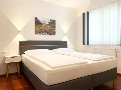 Ein Bett oder Betten in einem Zimmer der Unterkunft Appartement Jana by Schladming-Appartements