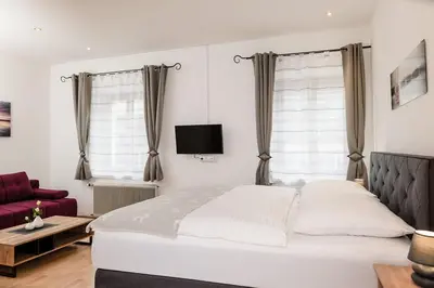 Ein Bett oder Betten in einem Zimmer der Unterkunft Central-Inn Werfen