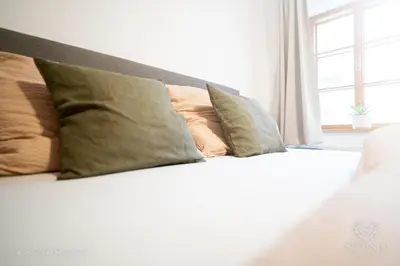 Ein Bett oder Betten in einem Zimmer der Unterkunft Ferienwohnung Somnia - Altstadt Gmunden
