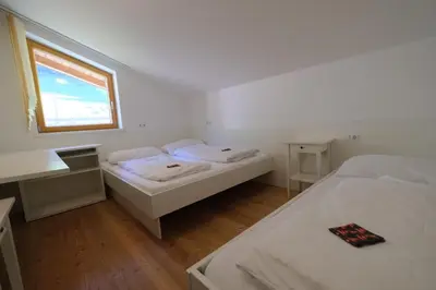 Ein Bett oder Betten in einem Zimmer der Unterkunft GO FOR MOUNTAINS Appartements