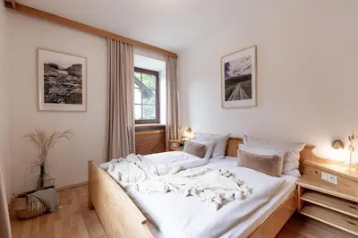 Ein Bett oder Betten in einem Zimmer der Unterkunft Der Thomataler Wirt