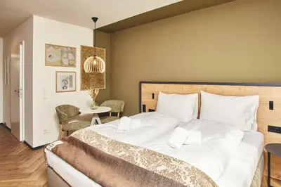 Ein Bett oder Betten in einem Zimmer der Unterkunft HOMEBOUND APARTMENTS Bad Goisern - contactless check-in