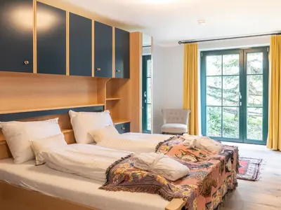 Ein Bett oder Betten in einem Zimmer der Unterkunft Holiday Home Katschberg 8 by Interhome