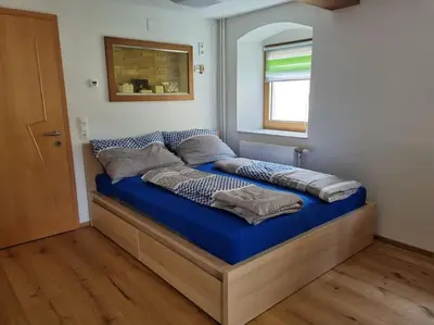 Ein Bett oder Betten in einem Zimmer der Unterkunft Schöne Wohnung am Bauernhof