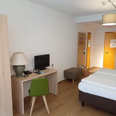 Ein Bett oder Betten in einem Zimmer der Unterkunft Gesundheit & Wellness Resort Bad Mitterndorf