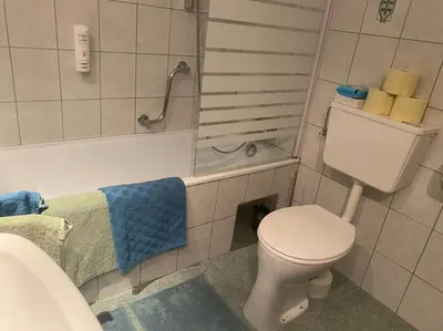 Ein Badezimmer in der Unterkunft Schöne Ferienwohnung mit Wolfgangseeblick