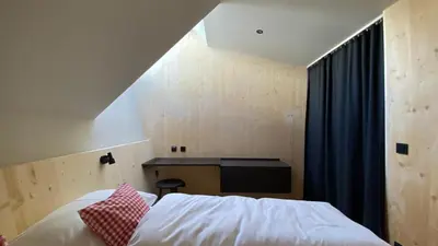 Ein Bett oder Betten in einem Zimmer der Unterkunft Hideaway Planneralm operated by JUFA Hotels