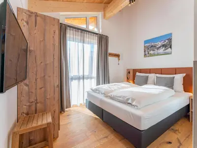 Ein Bett oder Betten in einem Zimmer der Unterkunft Grebenzen Eiszeit Lodge
