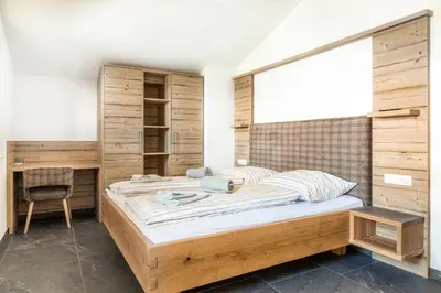 Ein Bett oder Betten in einem Zimmer der Unterkunft Taurachhof Astlehen
