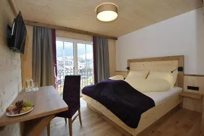 Ein Bett oder Betten in einem Zimmer der Unterkunft Das Dorfhotel Engl-Grafinger