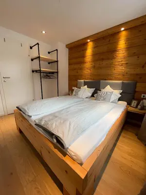 Ein Bett oder Betten in einem Zimmer der Unterkunft s'Manggei Gosau