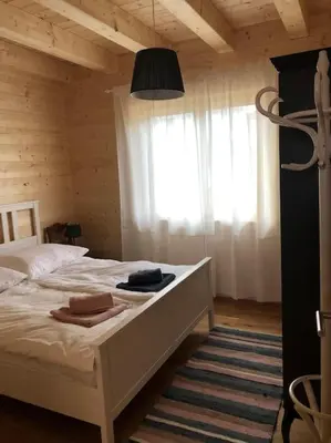 Ein Bett oder Betten in einem Zimmer der Unterkunft MyHolzhaus - zum Wohlfühlen