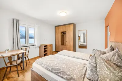 Ein Bett oder Betten in einem Zimmer der Unterkunft Hallstatt Lakeside Top 1