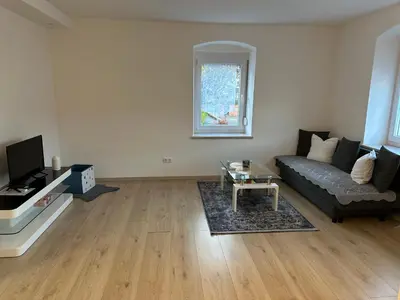 Ein Sitzbereich in der Unterkunft Ferienwohnung Niederthalheim