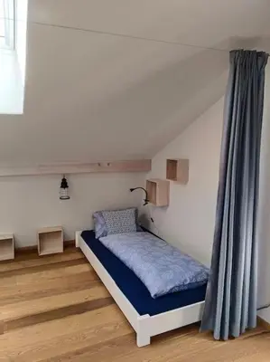 Ein Bett oder Betten in einem Zimmer der Unterkunft Haus Grünfels ApARTment