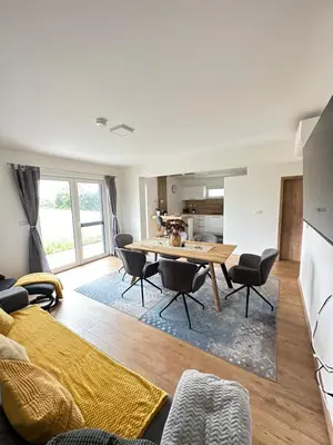 Ein Sitzbereich in der Unterkunft Resort am Winklfeld 8a