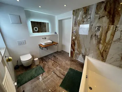 Ein Badezimmer in der Unterkunft Haus Bergfeld with the view over Dachstein