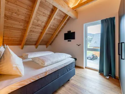 Ein Bett oder Betten in einem Zimmer der Unterkunft Bergzicht 2A