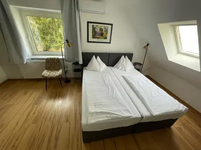 Ein Bett oder Betten in einem Zimmer der Unterkunft Ferienhaus Auerhahn