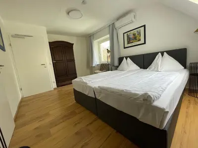 Ein Bett oder Betten in einem Zimmer der Unterkunft Ferienhaus Auerhahn