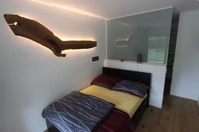 Ein Bett oder Betten in einem Zimmer der Unterkunft Ferien im grünen Reiterndorf