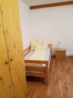 Ein Bett oder Betten in einem Zimmer der Unterkunft Helles und großzügiges Souterrain Appartement