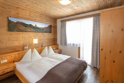 Ein Bett oder Betten in einem Zimmer der Unterkunft Apparthotel Kirchgasser