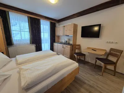 Ein Bett oder Betten in einem Zimmer der Unterkunft Apparthotel Kirchgasser