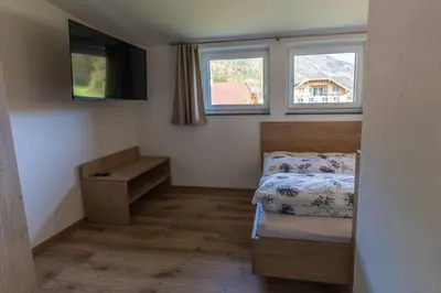 Ein Bett oder Betten in einem Zimmer der Unterkunft Ferienwohnung Eisl 2